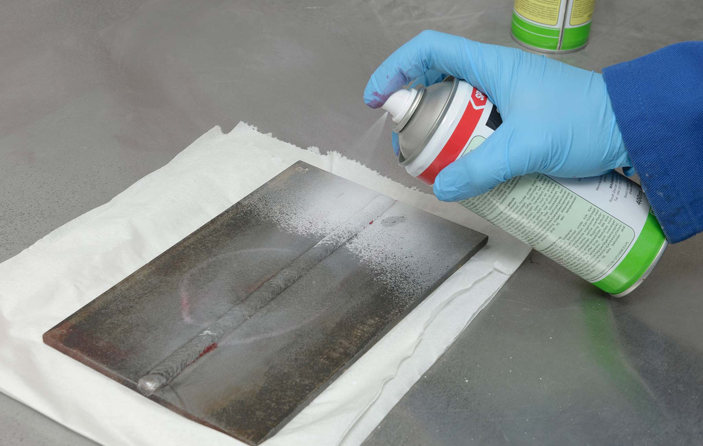 Magnaflux Spotcheck Dye Penetrant Kit - SK-816 in action, demonstrating its utility in identifying surface defects in metal work.