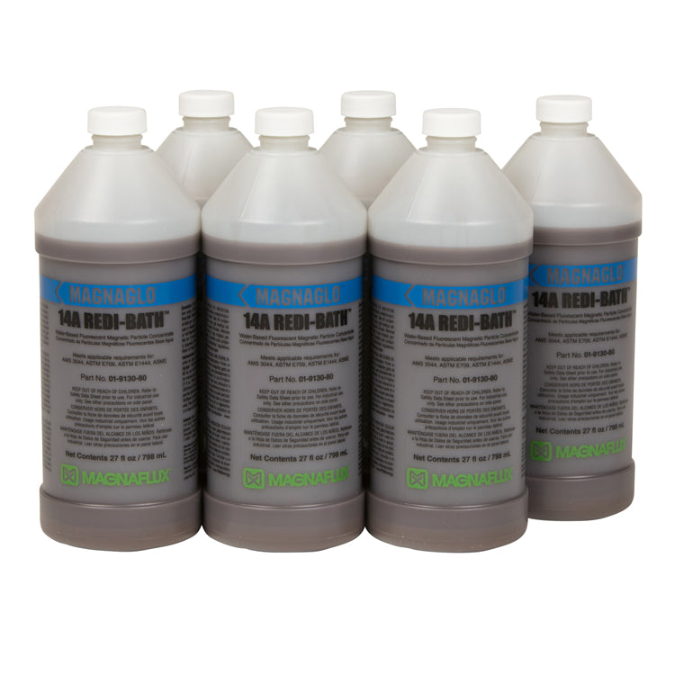 Magnaflux 14A Redi-Bath Fluorescent Particles in a set of eight bottles, showcasing water-based magnetic particle concentrate for effective flaw detection in metal parts.