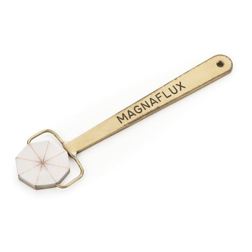 Magnaflux Pie Field Indicator with a golden handle and distinct star design, perfect for identifying magnetic flux in ferrous materials.