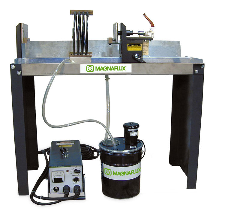 Magnaflux Standard Mag Kit showcased on a stainless steel bench, featuring a P-series power supply and magnetic particle application setup for non-destructive testing.